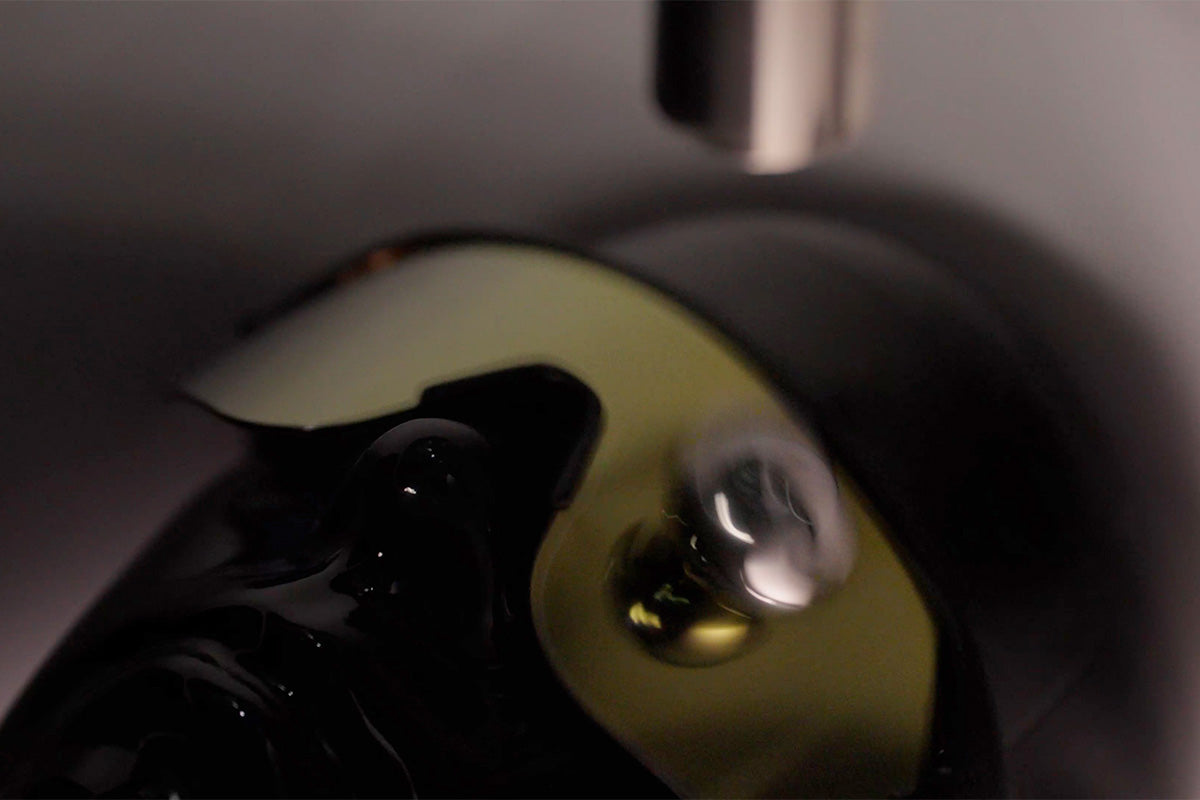 Close-up of a black glove with a reflective surface